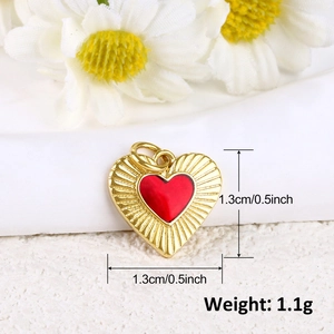 Detail view of 18k gold plated hollow heart pendant with red enamel and size measurements