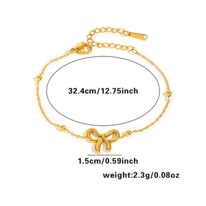 Detail of gold butterfly bracelet with dimensions 32.4cm length and 1.5cm charm width