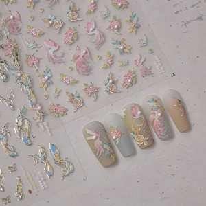 Detailed 5D embossed nail stickers featuring phoenix motifs, floral patterns and pearls