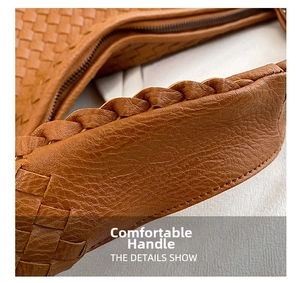 Macro shot of the woven handle on a caramel brown leather handbag with fine textures