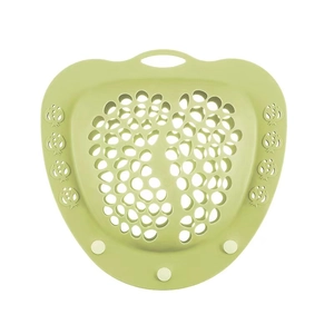 Detail view of heart-shaped green silicone laundry mesh filter with drainage holes