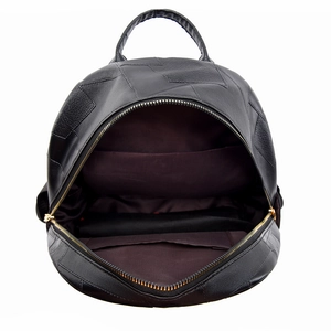 Minimalist black faux leather backpack with spacious interior and gold zippers