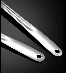 Detail of 304 stainless steel kitchen tool handle with brushed finish and hanging hole