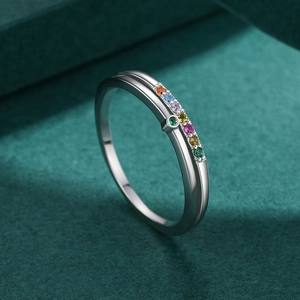 Minimalist S925 sterling silver ring with colorful micro-set gemstones on dark velvet