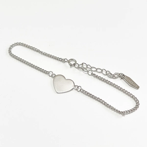 Minimalist 925 sterling silver chain bracelet with a polished heart-shaped charm and clasp