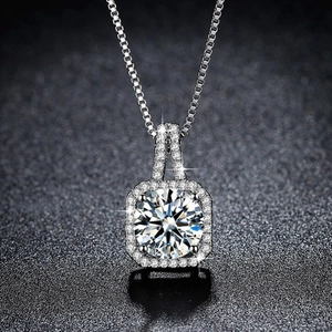 Macro shot of 2-carat heart and arrow zircon pendant on silver chain necklace