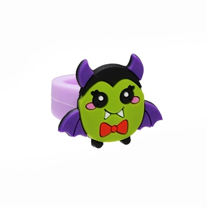 Detail of purple PVC cartoon vampire ring for children featuring a cute ghost toy design