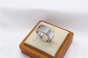 Close-up of polished silver stainless steel signet ring with a flat rectangular top surface