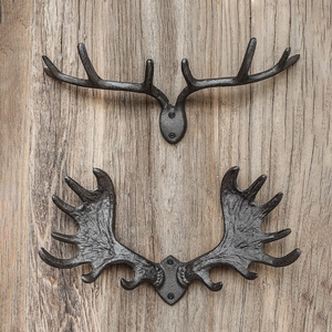 Vintage cast iron antler decorative wall hooks for coats in rustic dark iron finish
