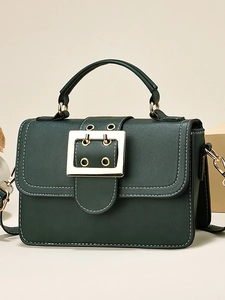 Chic dark green crossbody flap bag with golden hardware and white contrast stitching
