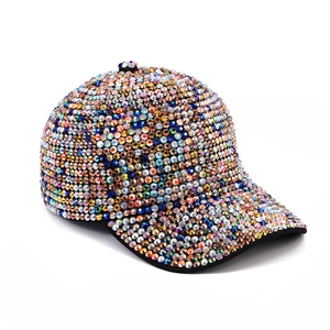 Sparkling multi-color rhinestone baseball cap with adjustable strap on white background
