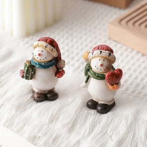 Christmas snowman figurines set with red hat and green scarf for festive tabletop decor