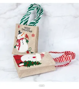Linen Christmas gift bags featuring snowman and Santa Claus designs with striped handles