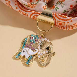 Detailed view of golden elephant scarf buckle with colorful crystals and pearls