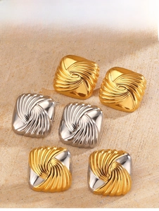 Detailed view of geometric square stud earrings with spiral texture in gold and silver