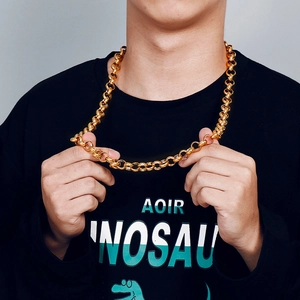 Detail of chunky 18K gold plated titanium steel chain necklace on male model neck