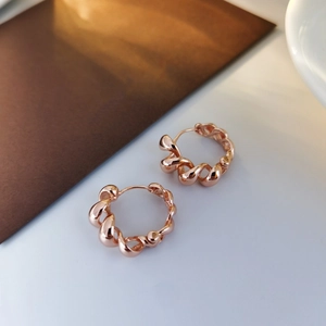 Elegant 925 sterling silver hoop earrings with twisted rose gold rope design texture