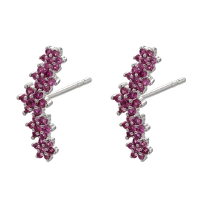 Macro shot of curved floral stud earrings with pink zircon clusters in silver finish