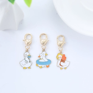 Detailed set of cute duck enamel charms with medical, swim and baker themes and heart clips
