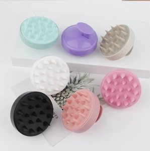 Top view of 19-tooth silicone scalp massage brushes in seven vibrant assorted colors