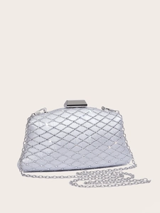 Macro shot of silver evening clutch with dense rhinestones and quilted texture detail
