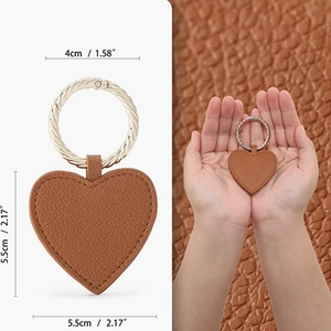 Brown heart-shaped leather hat clip with magnetic closure and sizing details shown