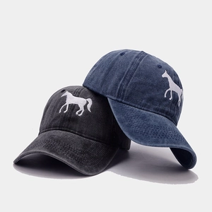 Detail of dark grey and navy blue washed cotton baseball caps with horse embroidery