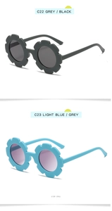Detail view of flower-shaped kids' sunglasses in grey and light blue frame colors
