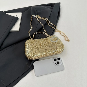 Elegant gold sequin evening clutch bag with round metal handle and detachable chain strap