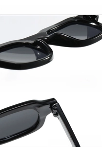 Detail of square sunglasses featuring lightweight integrated nose pads and durable hinges