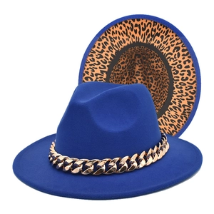 Close-up of royal blue wool fedora with gold chain and leopard print underbrim details