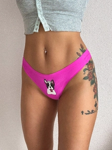 Macro detail of rose red seamless thong featuring a crown bulldog cartoon print