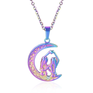 Macro detail of crescent moon pendant with celtic knot and rainbow finish on white surface