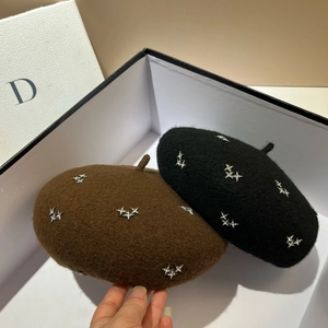 Sparkling star rhinestone wool beret in black and dark brown placed in a white gift box