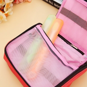 Portable red travel storage pouch with pink mesh compartments and smooth zipper closure