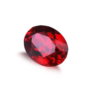 Oval cut synthetic pigeon blood ruby gemstone with vibrant sparkle on white background