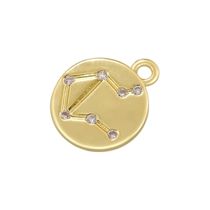 Detailed close-up of a gold Libra constellation pendant with micro-inlaid cubic zirconia stones