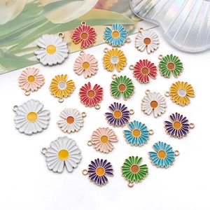 Close-up of colorful daisy alloy enamel charms in various sizes for DIY jewelry making