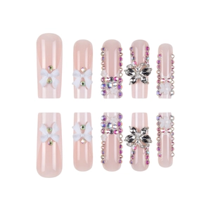 Pink press-on nails set with 3D white bows, silver butterflies and sparkling crystals