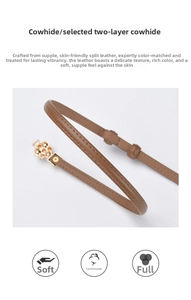 Detail of slim cowhide leather belt with gold floral buckle and fine edge stitching