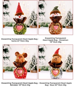 Detail of Christmas drawstring gift bags with Santa patterns and heart-shaped windows
