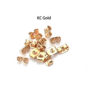 Macro shot of KC gold butterfly earring backs replacements on white background