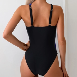 Detailed back view of a one-piece swimsuit featuring adjustable silver strap buckles