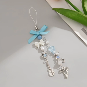 Blue bow phone charm with star and guitar pendants on beaded chain with green leaves
