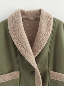 Detail of army green suede jacket featuring beige faux shearling collar and fluffy textures