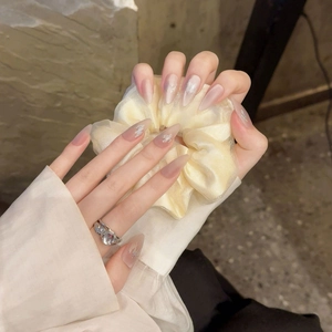 Sparkly reflective silk gradient press-on nails in elegant almond shape for women