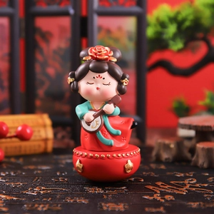 Detail of Tang Dynasty lady tumbler figurine playing pipa with red and green hanfu
