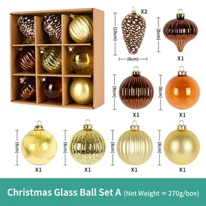 Macro view of 8cm gold and bronze glass Christmas ornaments with detailed textures