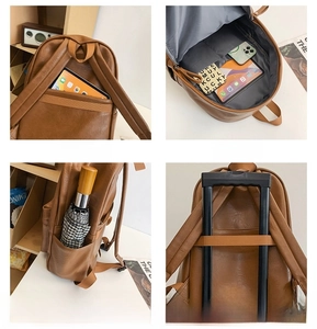 Brown PU leather backpack detail showing anti-theft pocket and trolley sleeve feature