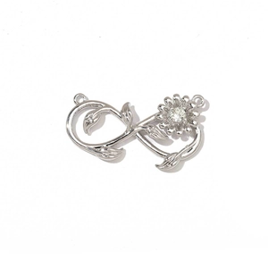 Detailed view of silver infinity rose charm with crystal inlay for DIY jewelry making